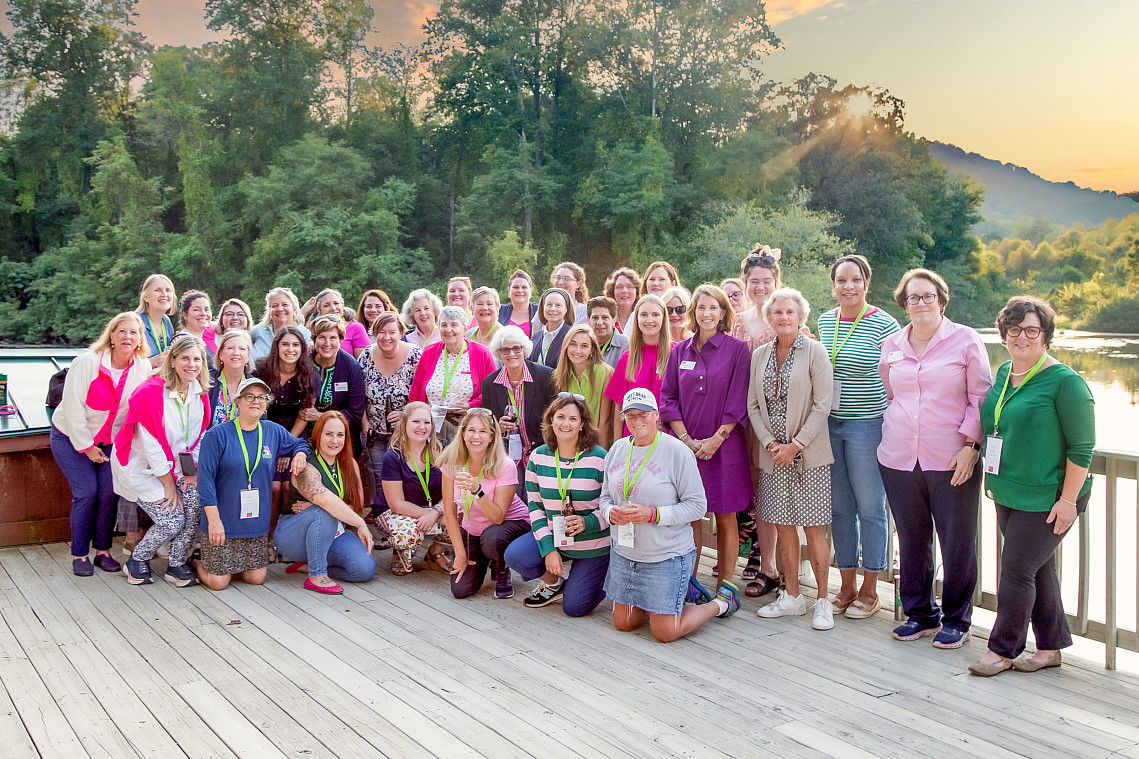 a group of women on the upper deck of Sweet Briar's boat house