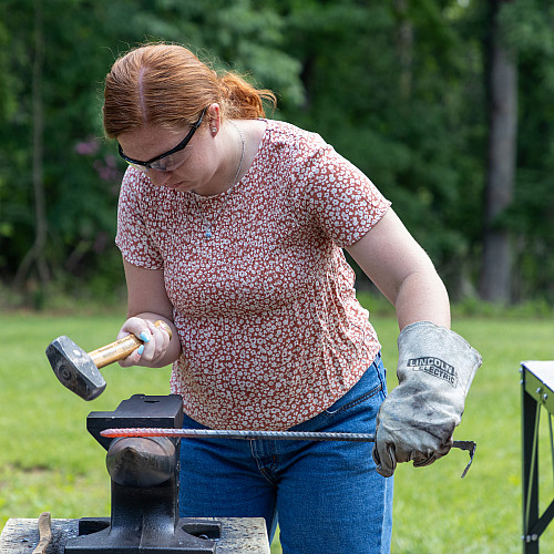 Student blacksmithing
